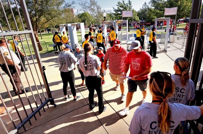 Stadium entry gate with event staff